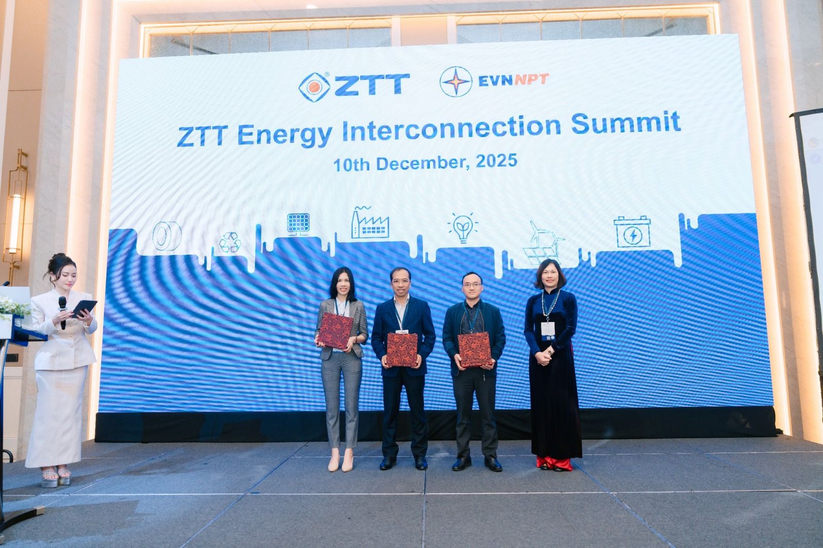 A group of people standing in front of a large screenAI-generated content may be incorrect.